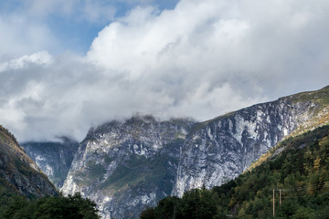 Mountains near &Aring;ndalsnes in Norway, rocky hills and beautiful sky, scenic nature valley with clouds view