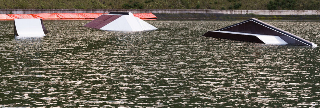 Panoramic view of wake park with equipment for tricks on water