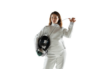 Champion. Teen girl in fencing costume with sword in hand isolated on white background. Young...