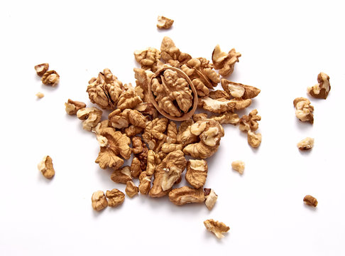 The purified kernel of a walnut isolated on a white background. Set or collection. The view from the top.