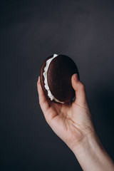 Close up Traditional chocolate and Pumpkin Whoopie pies made with vanilla cream cheese. Background for bakeries, cafes, restaurants