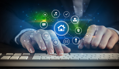 Business woman woman typing on keyboard with application icons around
