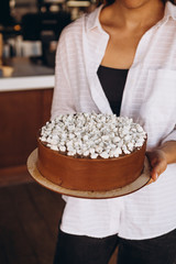 delicious and mouth watering white chocolate icing cake, nuts and crispy meringue, Kiev cake