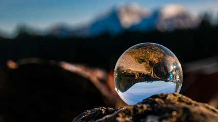 Crystal ball alpine landscape shot at the famous Hintersee, Ramsau, Berchtesgaden, Bavaria, Germany