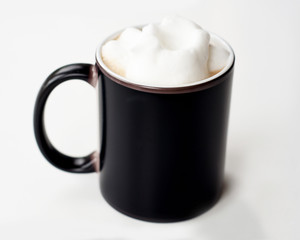 Black coffee mug with frothed milk mockup