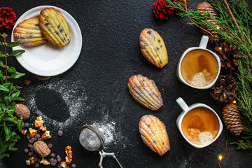 Madeleine cookies, sweet dessert and coffee on the table (delicious pastries, sweets) menu concept. food background. top view. copy space