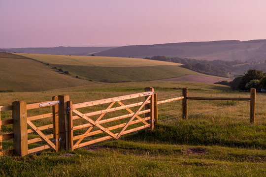 rural landscape with fence and clear sky before sunset