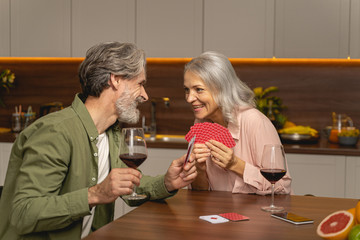 Two card players staring at each other