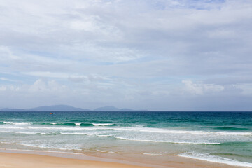 View of an empty tropical beach at sunset