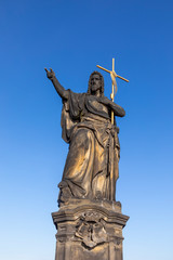 Fototapeta na wymiar Statue of John the Baptist on Charles Bridge