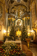 Fototapeta premium Czestochowa, Poland, January 1, 2020: Cathedral on Jasna Góra in Czestochowa decorated with Christmas trees and lights during Christmas.