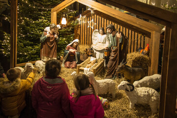 Czestochowa, Poland, January 1, 2020: Children in front of the Christmas stable in the cathedral at...