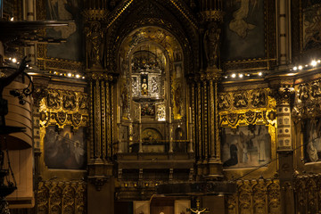 Fototapeta na wymiar Montserrat, Spain, June 23, 2019: Interior of the Basilica of Montserrat in Spain with the statue of the Black Madonna