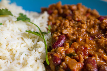 Tex Mex beef chili with tomatoes and red beans with rice and fresh coriander..Delicius hot and spicy traditional mexican food. Flavours of world