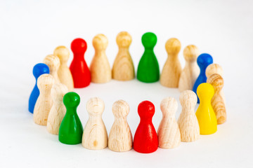 Playful Concepts: group of game figurines in a circle standing for the concepts unity, integration, diversity, cooperation