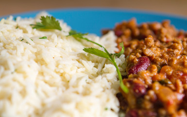 Tex Mex beef chili with tomatoes and red beans with rice and fresh coriander..Delicius hot and spicy traditional mexican food. Flavours of world
