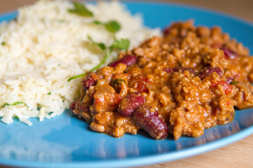 Tex Mex beef chili with tomatoes and red beans with rice and fresh coriander..Delicius hot and spicy traditional mexican food. Flavours of world