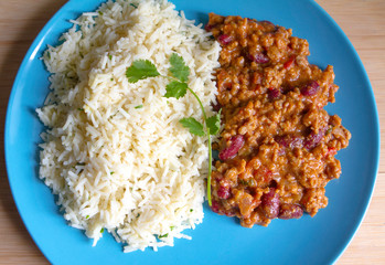 Tex Mex beef chili with tomatoes and red beans with rice and fresh coriander..Delicius hot and spicy traditional mexican food. Flavours of world