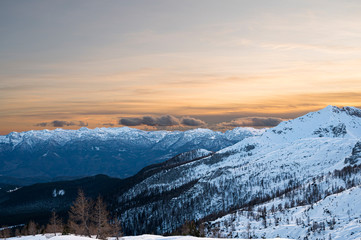 Fototapeta na wymiar Spectacular winter mountain panoramic view of mountains at sunset.