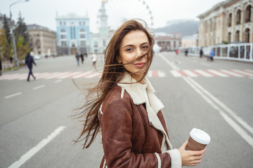 Portrait of long haired woman that posing on camera