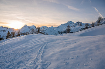 Spectacular winter mountain panoramic view of mountains at sunset.