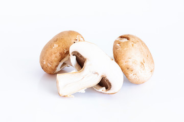 Fresh champignon mushrooms on white background, Isolated food and nature object