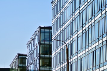 Fototapeta premium The windows of a modern building for offices. Business buildings architecture.