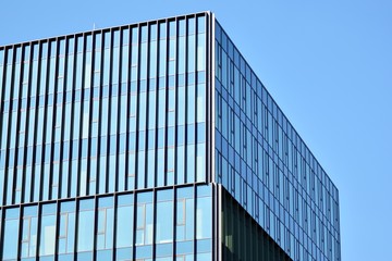 The windows of a modern building for offices. Business buildings architecture.