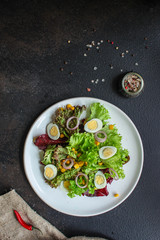 healthy salad corn, quail eggs, leaves mix (green vitamins) menu concept. food background. top view. copy space