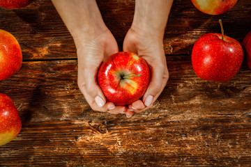 Apples and woman hands. Free space for your decoration. 