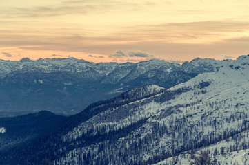 Spectacular winter mountain panoramic view of mountains at sunset.