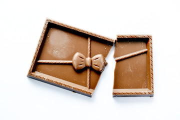 sweet chocolate pieces on white background