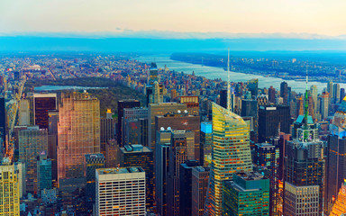 Aerial panoramic view to Midtown Manhattan and Central Park, NYC, USA. Skyline with skyscrapers at sunset. New York city. American architecture building. Panorama of Metropolis. Cityscape