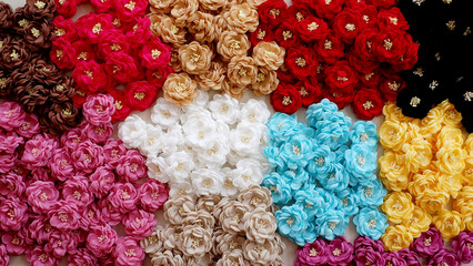 Colorful flowers DIY project made out of fabric or cloth. These handmade flowers with stamen are great for handicraft project.