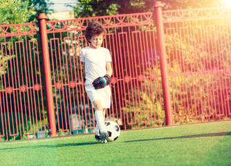 Children's soccer football - a match of young children on the football field