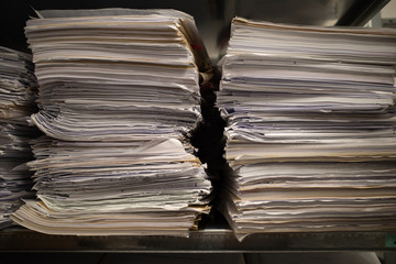 in a file archive there are shelves filled with mountains of files