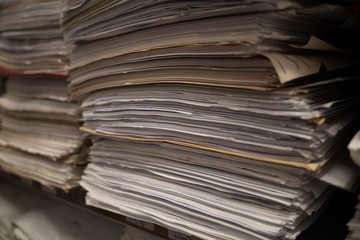 in a file archive there are shelves filled with mountains of files