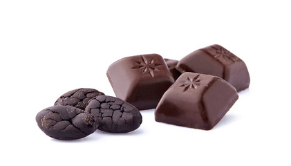Cacao beans and chocolate on white background