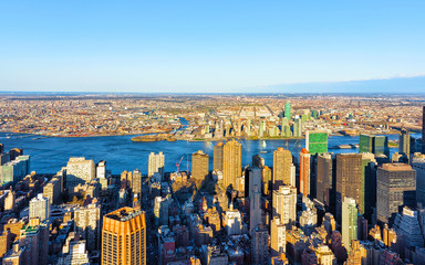 Panoramic view on Midtown district of Manhattan in New York, NYC. East river and Queensboro Bridge in Long Island City. Skyline, USA. American architecture building. Aerial Panorama of Metropolis.
