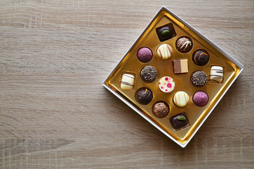 Chocolate candy box on a wooden background.Valentine's day or Birthday gift concept.Selective focus.