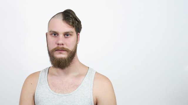 Half shaved head guy with a beard.Haircut before and after.