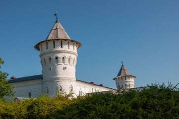 Fototapeta na wymiar Historical and Architectural Museum-Reserve with Kremlin and round ancient tower from white brick