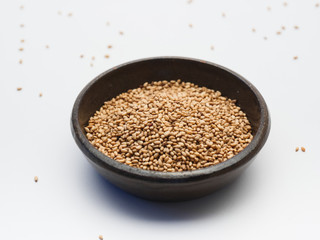 Toasted sesame seeds on crock bowl 