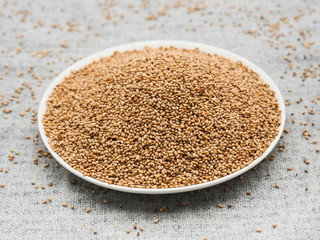 Toasted sesame seeds on white plate