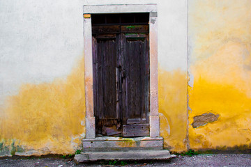door on yellow wall