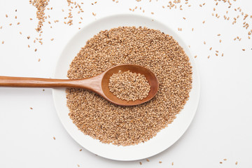 Sesame seeds on white background