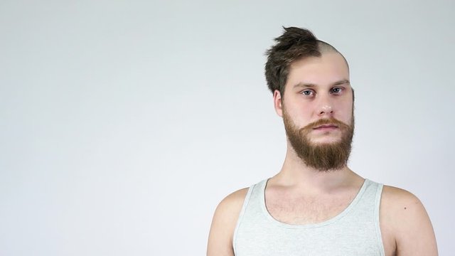 Half-head hair,the other bald.Haircut before and after.Place for text.Copyspace.