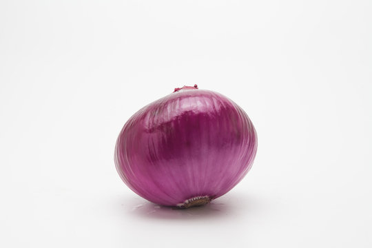 One red onion on a white background 