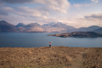 Scottish girl observing the scenery on the Isle of Mull
