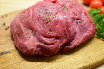 Beef tenderloin on a cutting board. Close-up